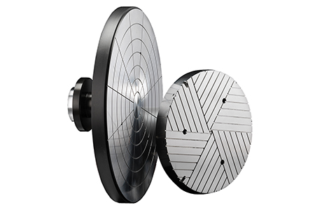 Cast-in aluminum wafer pedestal heater with encapsulated heating element and precision-machined surface for uniform temperature control in semiconductor tools.