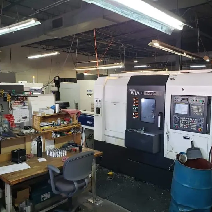 Hyundai WIA L2100SY CNC turning center inside Whale Precision Mfg, Inc.’s machine shop, used for high-precision production machining and turning operations.